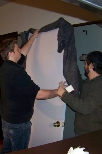 Jesse Low and Jeff Butler setting up the door